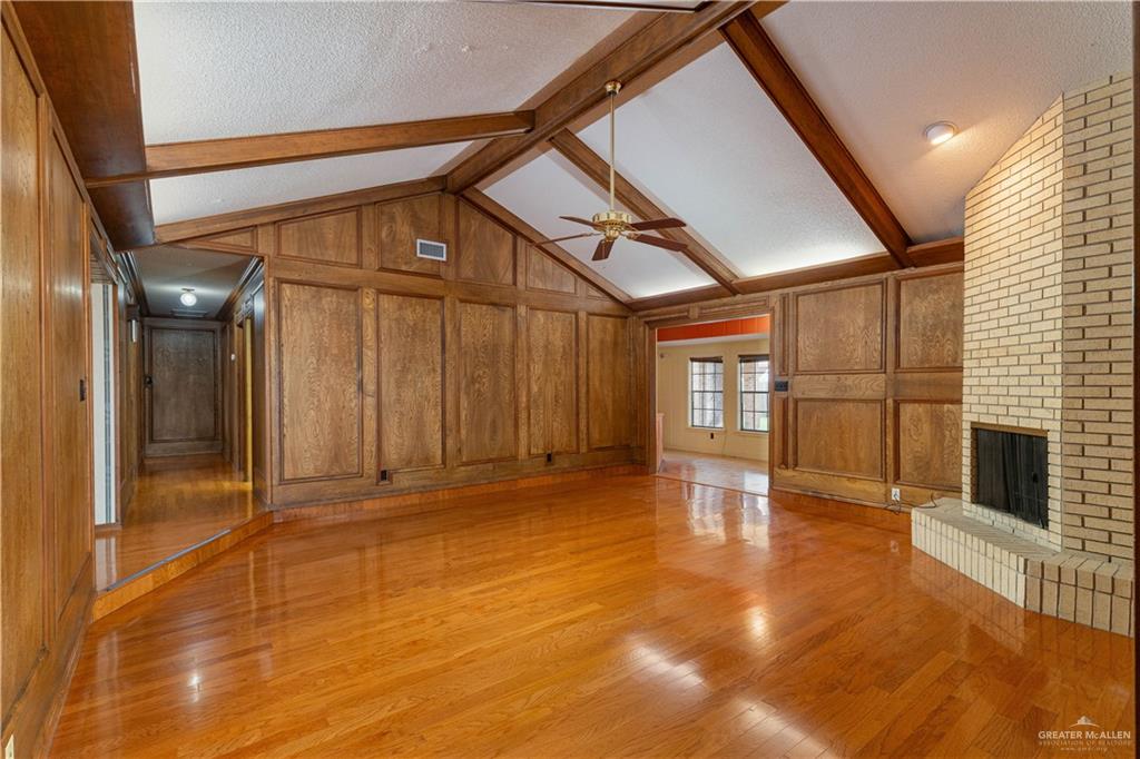 1100 Xanthisma Avenue McAllen, TX 78504 - Photo 6 of 26 a view of empty room with wooden floor and fan
