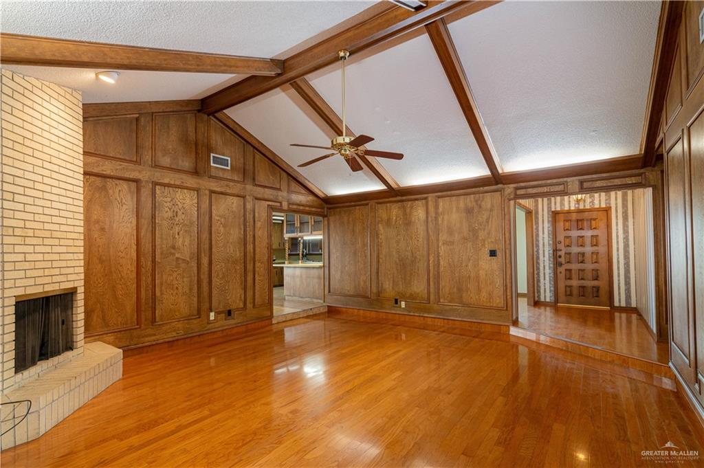 1100 Xanthisma Avenue McAllen, TX 78504 - Photo 7 of 26 a view of an empty room with wooden floor and a window