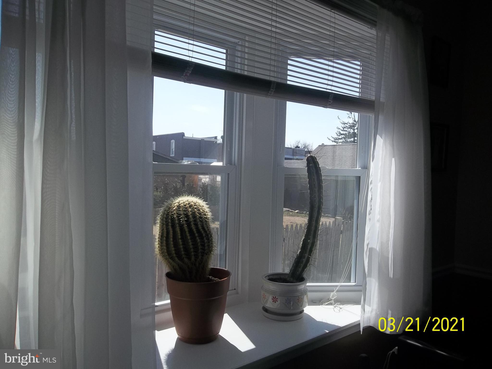128 Madison Street Riverside, NJ 08075 - Photo 14 of 40 a view of a wooden floor and a potted plant