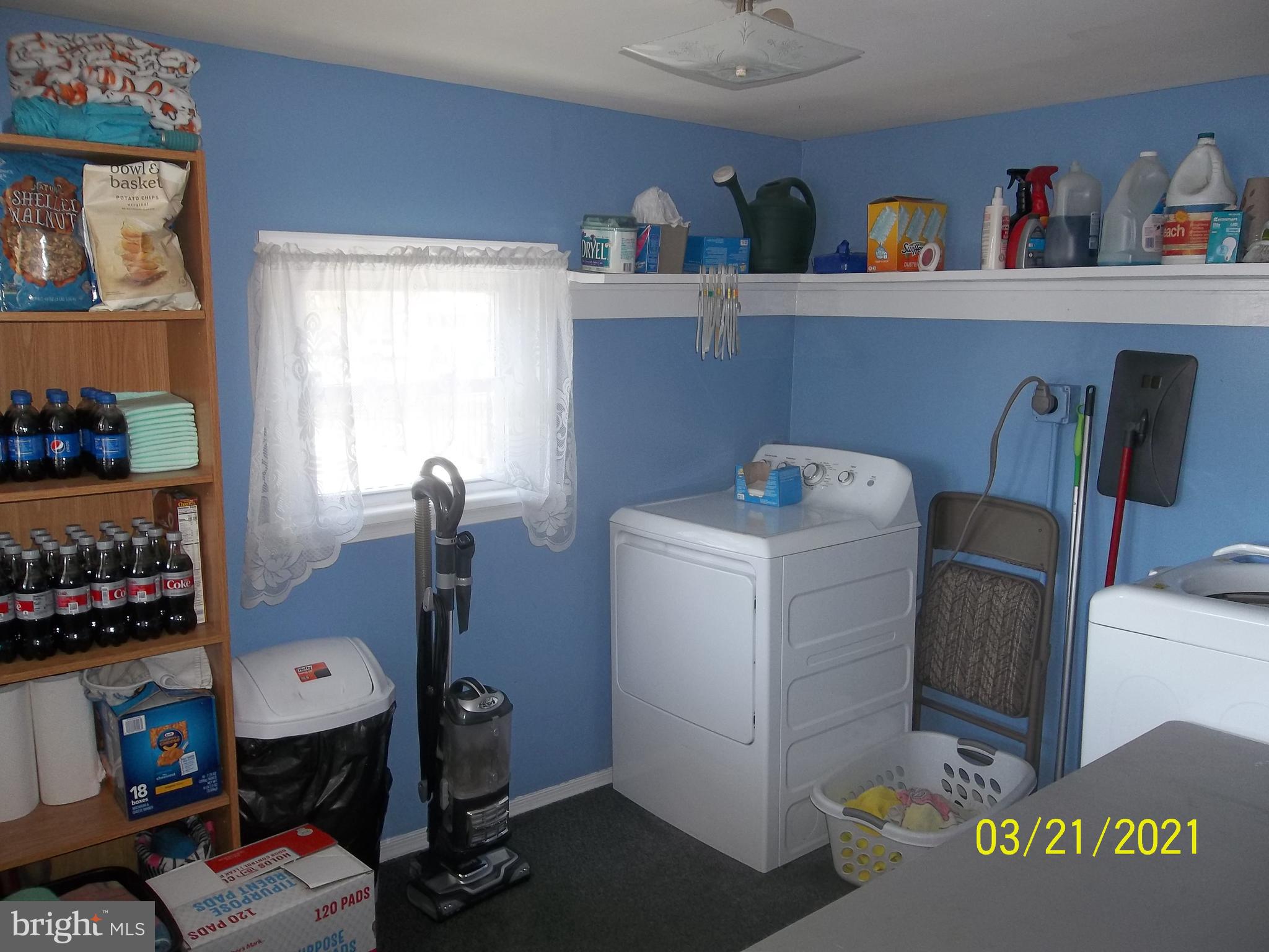 128 Madison Street Riverside, NJ 08075 - Photo 21 of 40 a storage room with washer and dryer