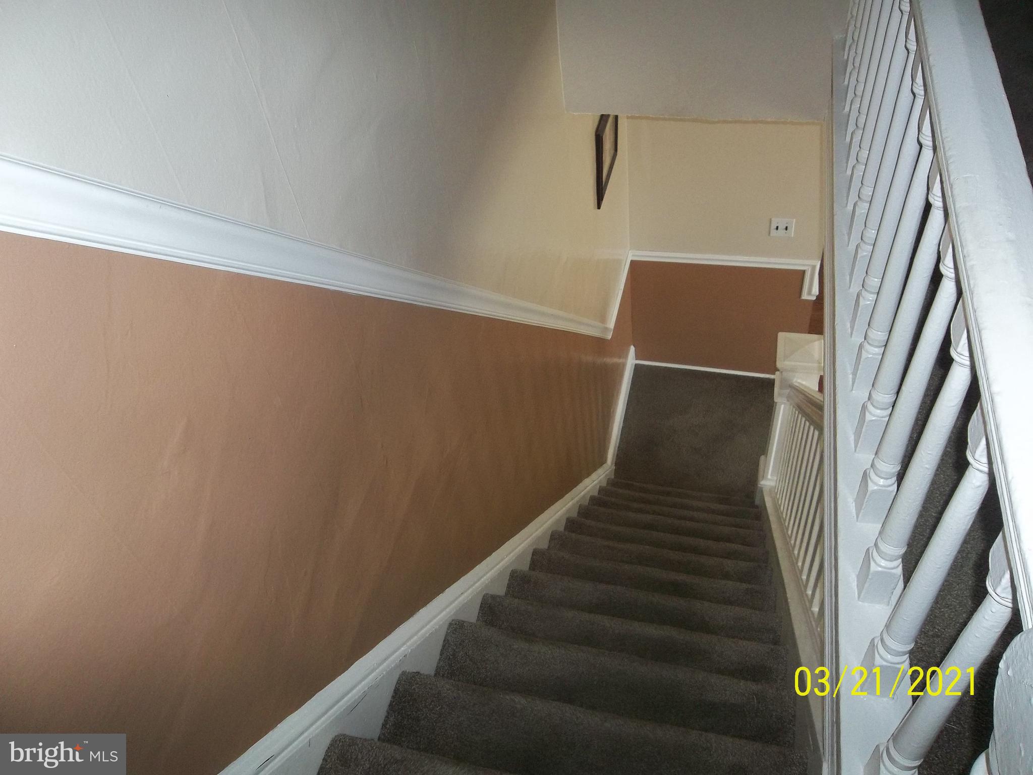 128 Madison Street Riverside, NJ 08075 - Photo 26 of 40 a view of staircase with wooden floor and white door