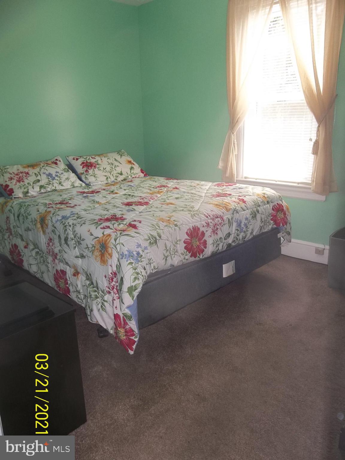 128 Madison Street Riverside, NJ 08075 - Photo 28 of 40 a bedroom with a bed and a window