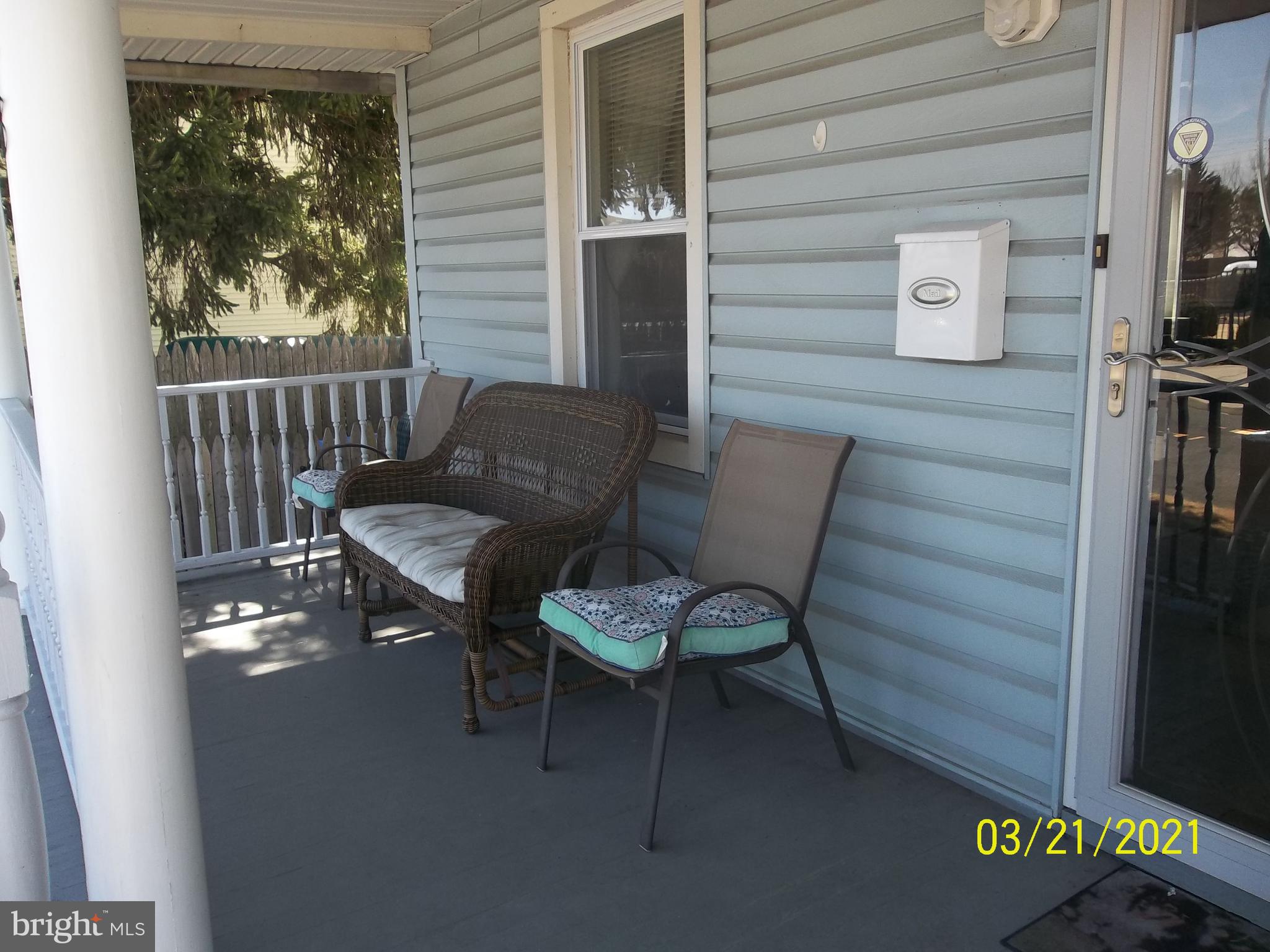 128 Madison Street Riverside, NJ 08075 - Photo 4 of 40 a view of a chair and table in the balcony