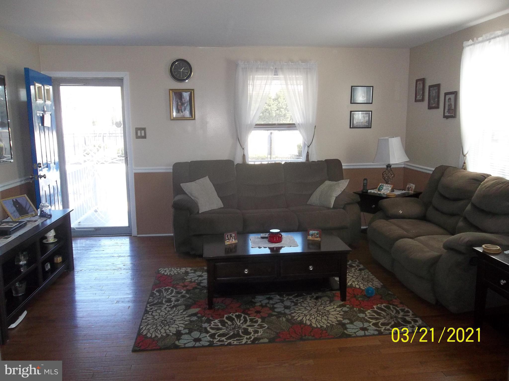 128 Madison Street Riverside, NJ 08075 - Photo 10 of 40 a living room with furniture and a flat screen tv