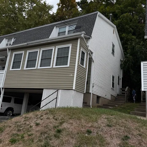 a view of house with backyard