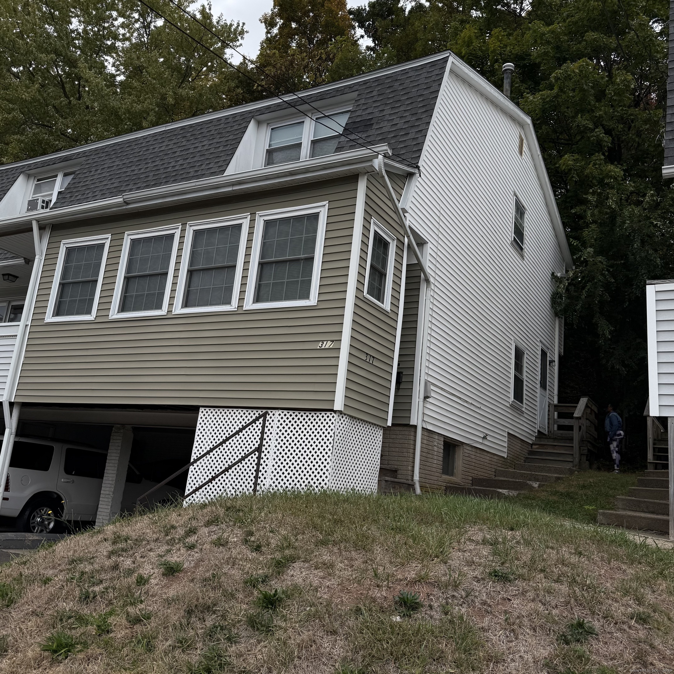 317 Mill Rock Road, Unit 317 Hamden, CT 06517 - Photo 2 of 2 a view of house with backyard