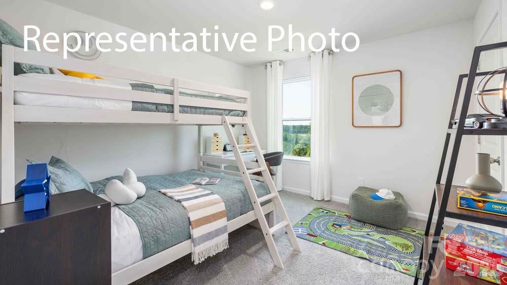 7592 Bainbridge Road Sherrills Ford, NC 28673 - Photo 19 of 28 a bedroom with a bed and a window
