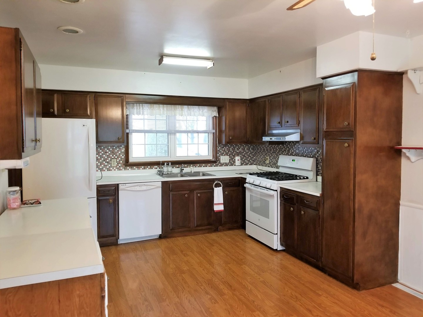 16210 Strawberry Road Morrison, IL 61270 - Photo 4 of 17 a kitchen with granite countertop a refrigerator stove top oven and sink