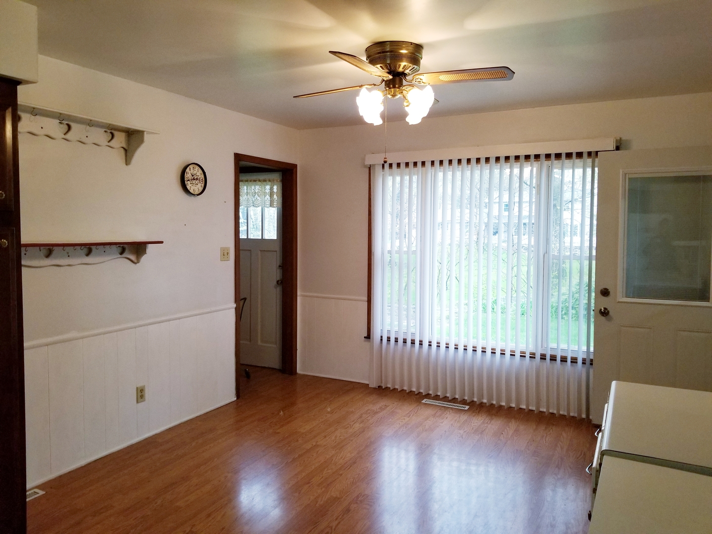 16210 Strawberry Road Morrison, IL 61270 - Photo 5 of 17 a view of an empty room with a window and wooden floor