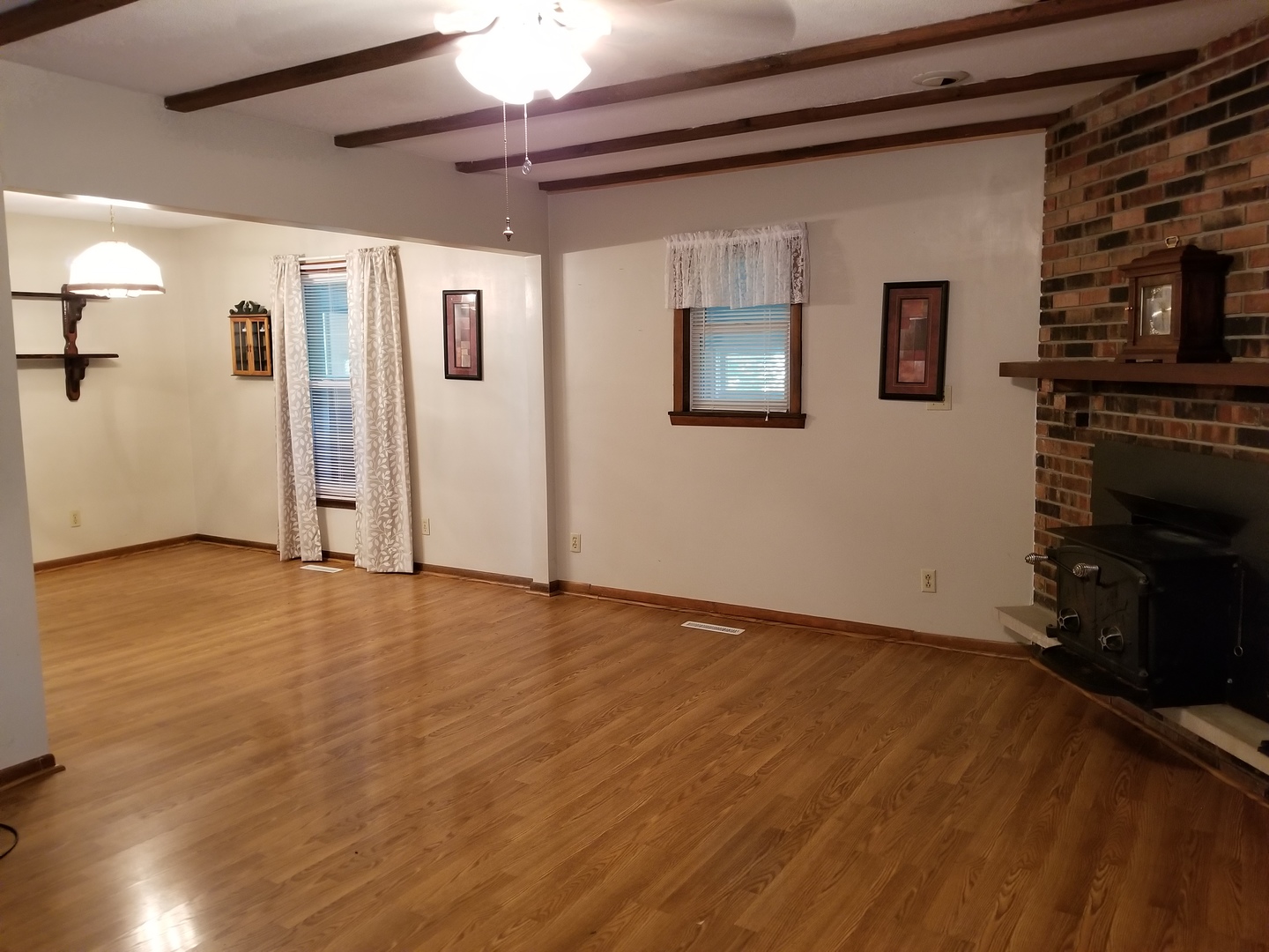 16210 Strawberry Road Morrison, IL 61270 - Photo 6 of 17 a view of an empty room with a fireplace