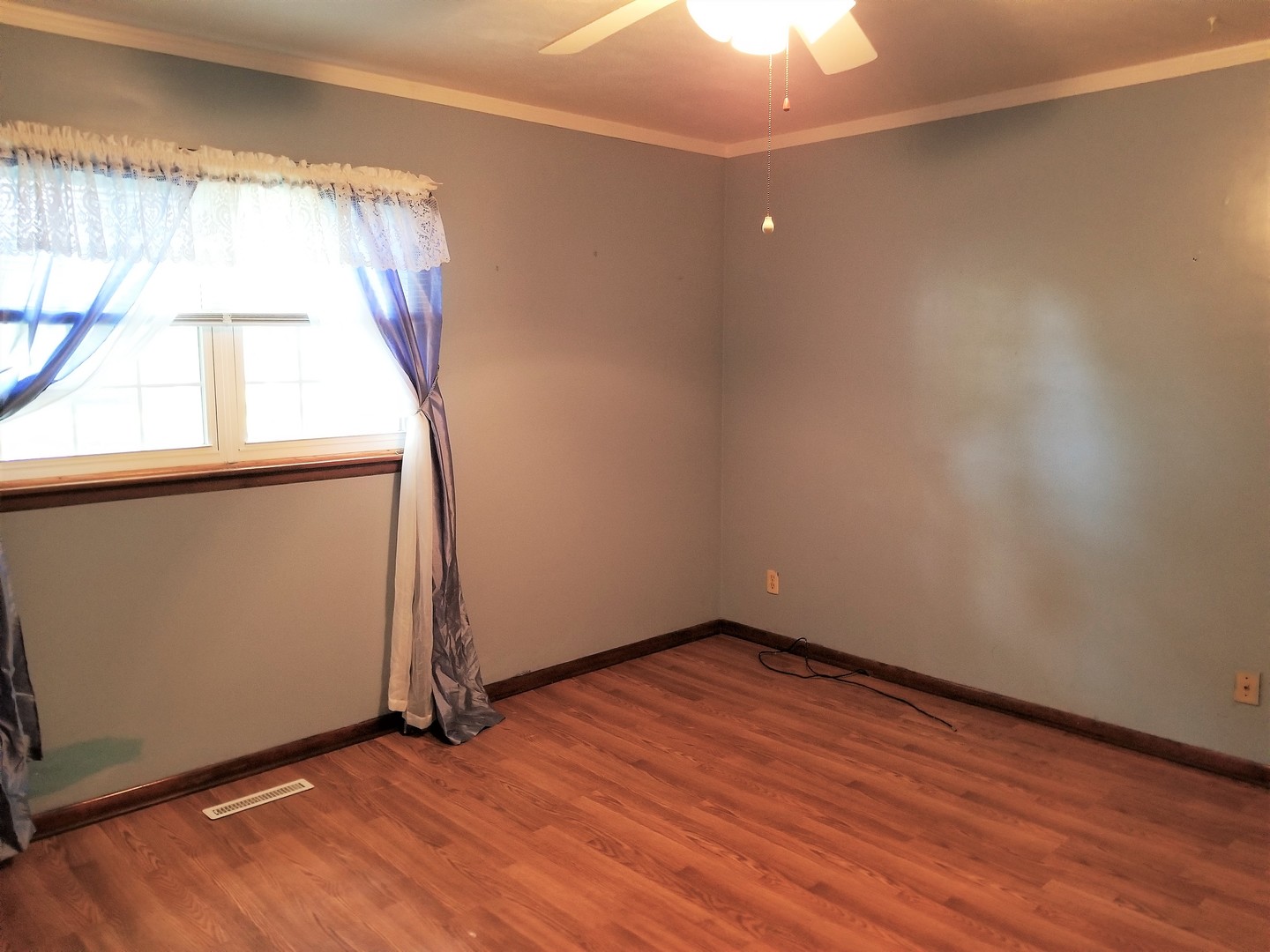 16210 Strawberry Road Morrison, IL 61270 - Photo 8 of 17 an empty room with wooden floor and windows
