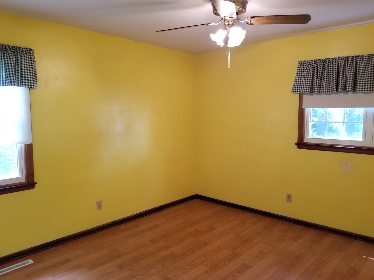 16210 Strawberry Road Morrison, IL 61270 - Photo 9 of 17 an empty room with a window and a ceiling fan