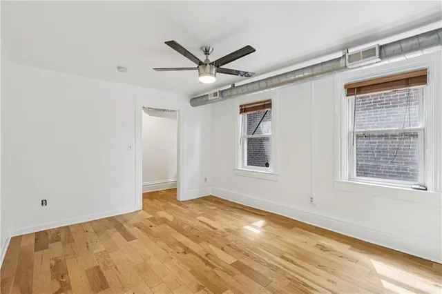 a view of an empty room with a window