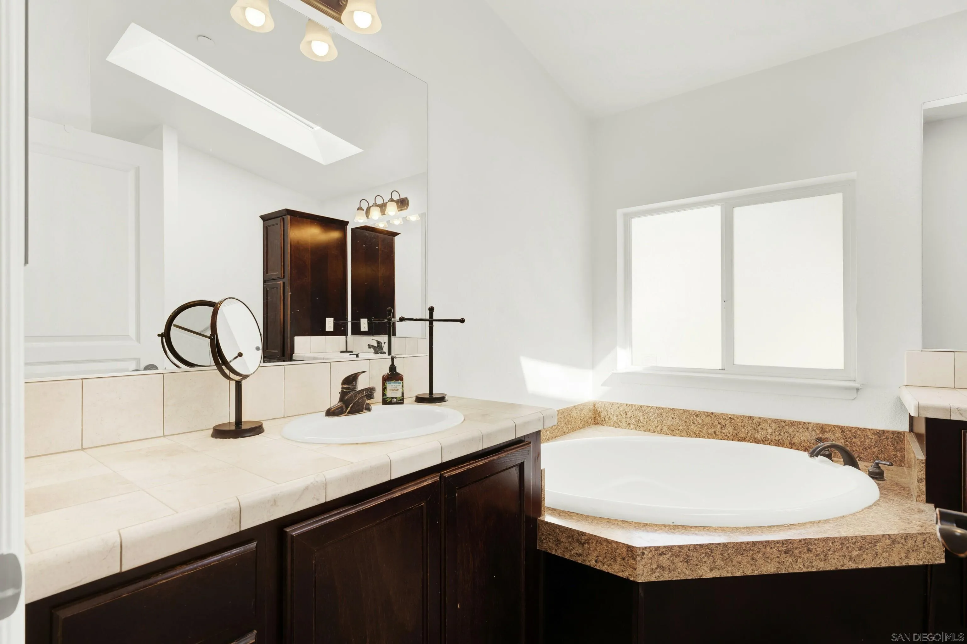 20885 Daum Road Jamul, CA 91935 - Photo 22 of 36 a bathroom with a sink and a bathtub