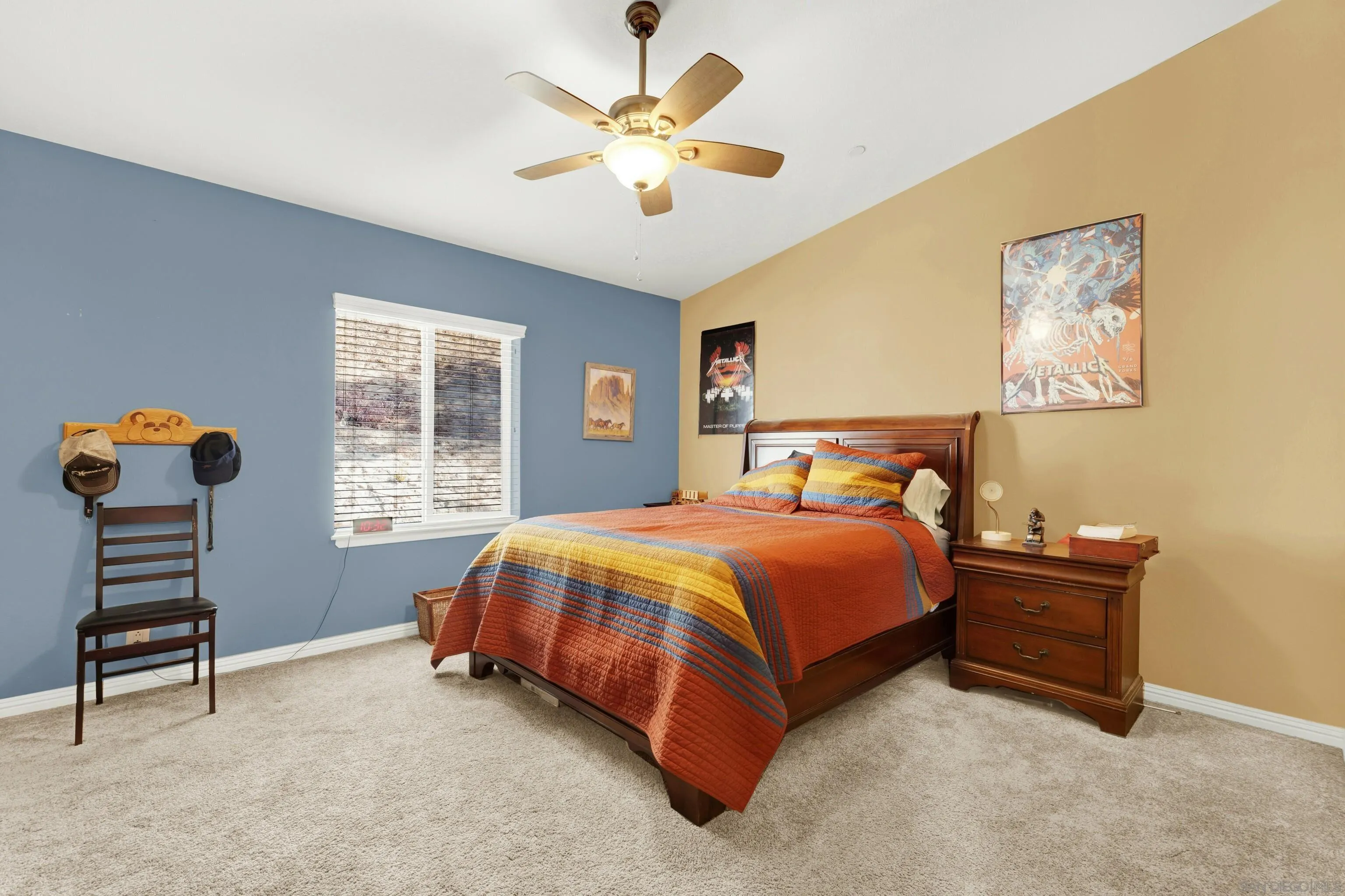 20885 Daum Road Jamul, CA 91935 - Photo 25 of 36 a bedroom with a bed and a chandelier