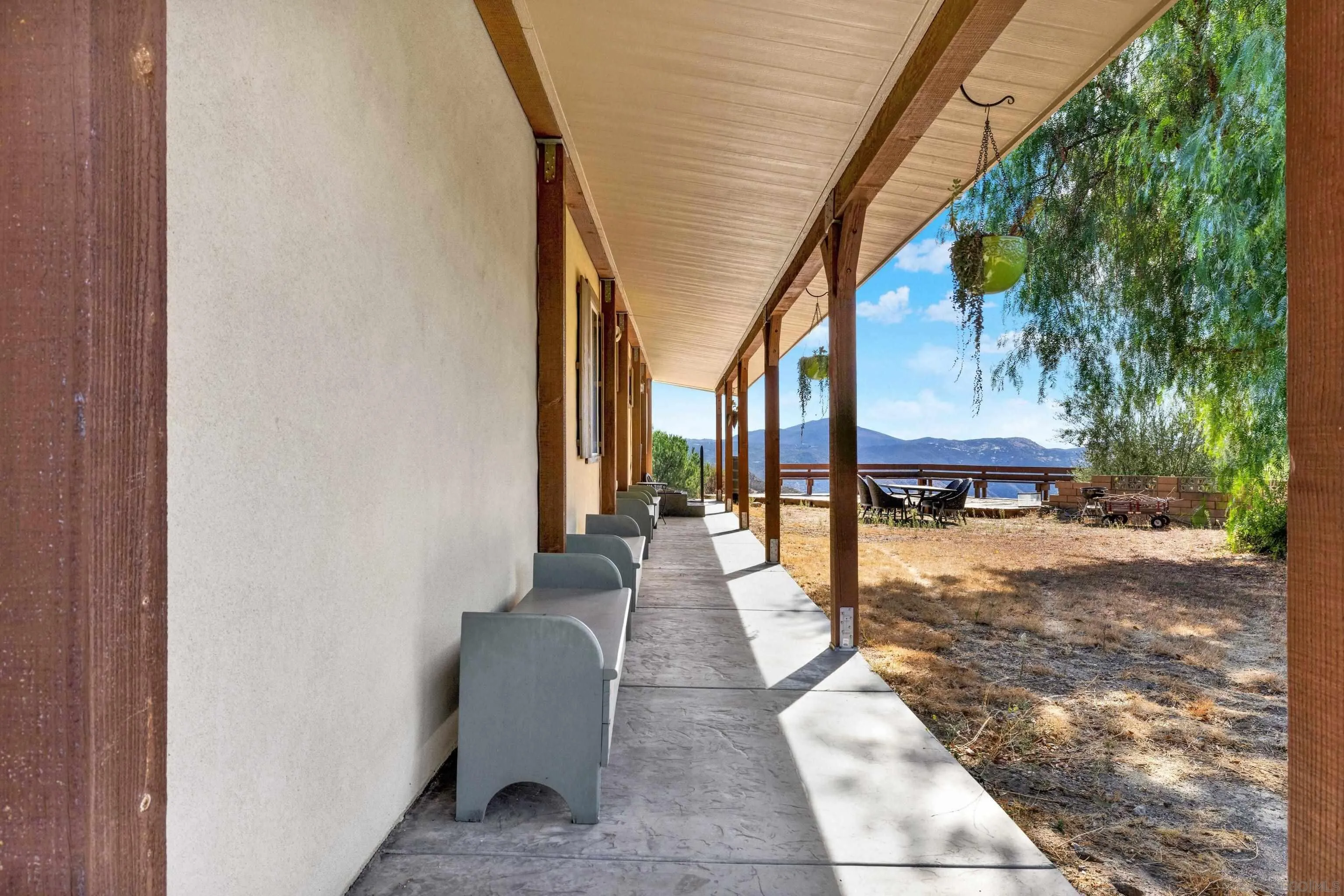 20885 Daum Road Jamul, CA 91935 - Photo 33 of 36 a view of a patio with a table and chairs