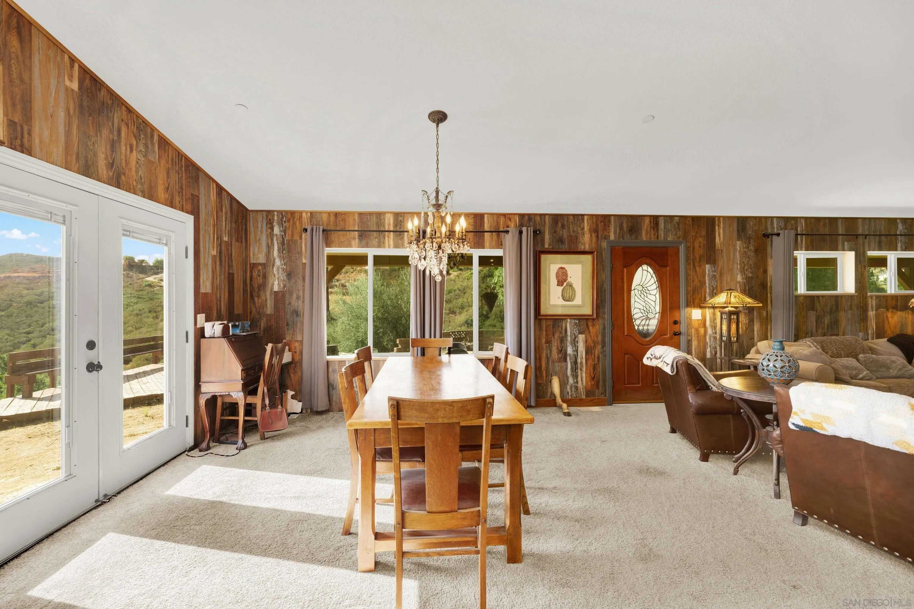 20885 Daum Road Jamul, CA 91935 - Photo 4 of 36 a living room with furniture and large windows