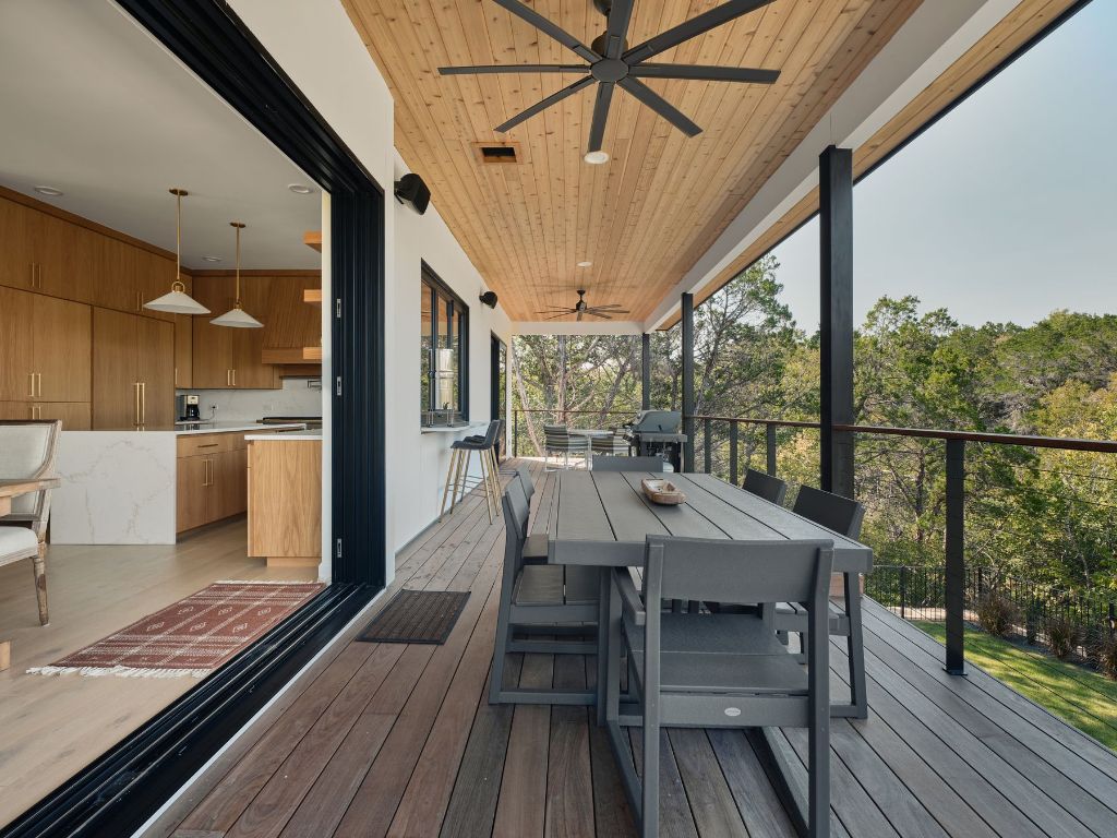 3214 Smoky Ridge Austin, TX 78730 - Photo 14 of 40 a view of a patio with a table chairs and a barbeque