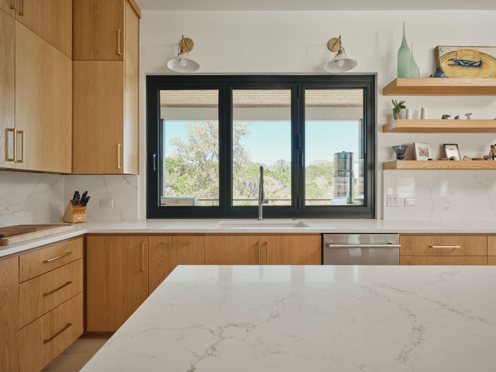 3214 Smoky Ridge Austin, TX 78730 - Photo 16 of 40 a view of a kitchen with granite countertop window and a sink