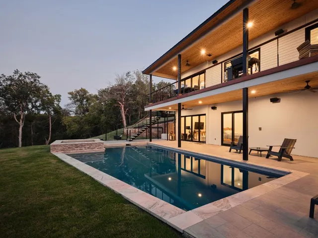 a view of a house with swimming pool