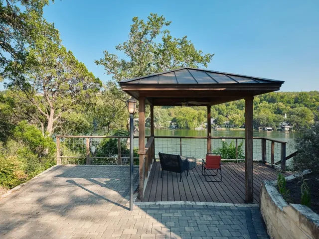 a view of a balcony with mountain view and wooden floor