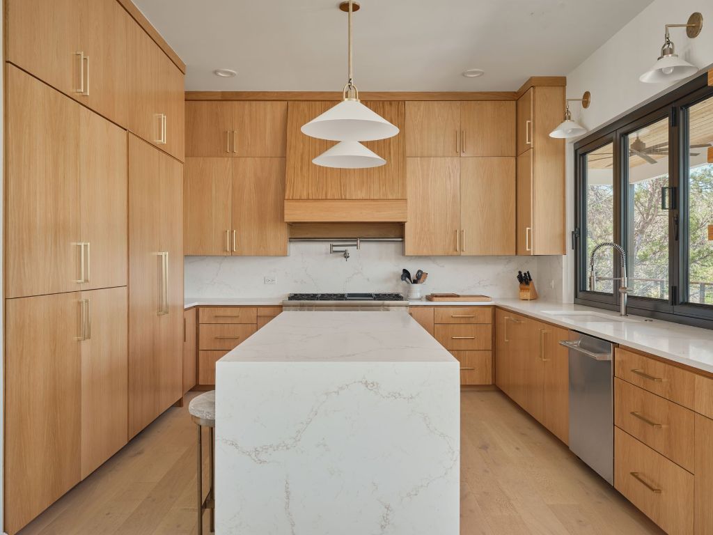 3214 Smoky Ridge Austin, TX 78730 - Photo 5 of 40 a kitchen with a sink window and cabinets