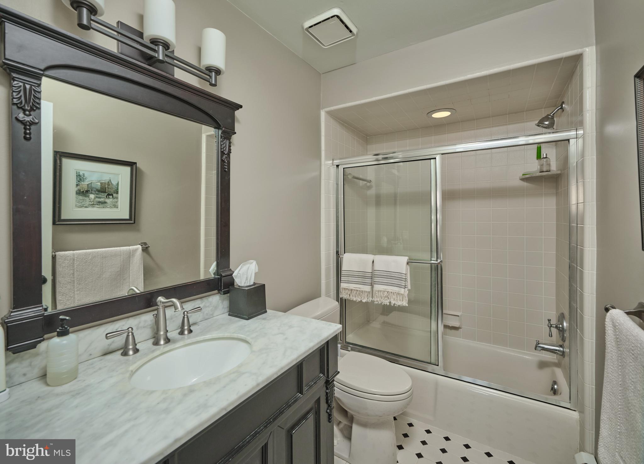 2976 River Road New Hope, PA 18938 - Photo 16 of 37 a bathroom with a granite countertop sink toilet and shower