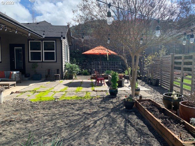 598 Oak Valley Loop Winchester, OR 97495 - Photo 18 of 21 a view of a swimming pool with a patio