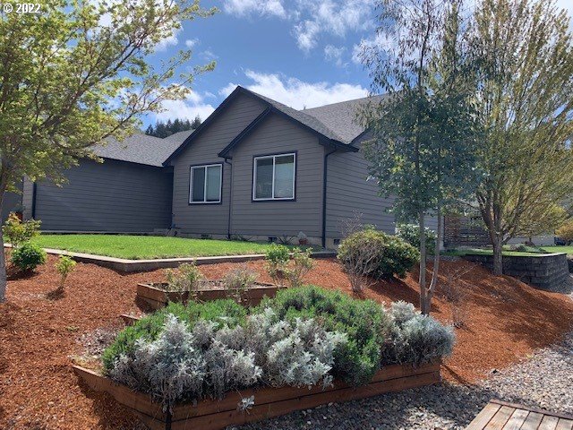 598 Oak Valley Loop Winchester, OR 97495 - Photo 20 of 21 a house with trees in the background