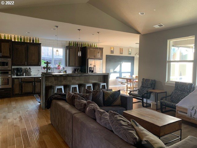 598 Oak Valley Loop Winchester, OR 97495 - Photo 4 of 21 a living room with fireplace furniture and a large window