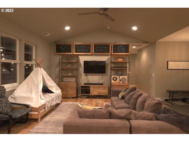 598 Oak Valley Loop Winchester, OR 97495 - Photo 10 of 21 a living room with furniture and a flat screen tv