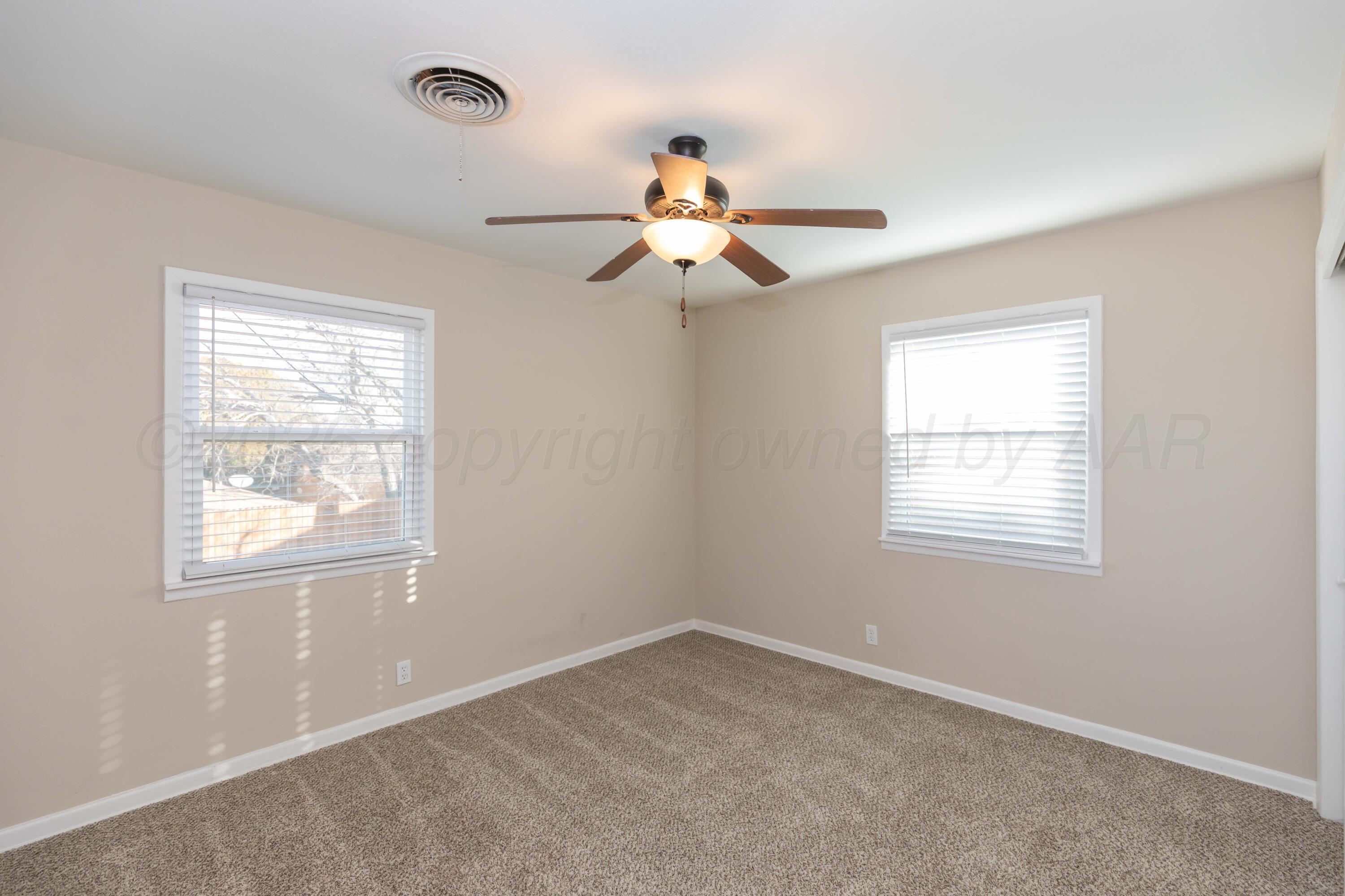 105 Smith Street Borger, TX 79007 - Photo 12 of 26 a window in an empty room with a window