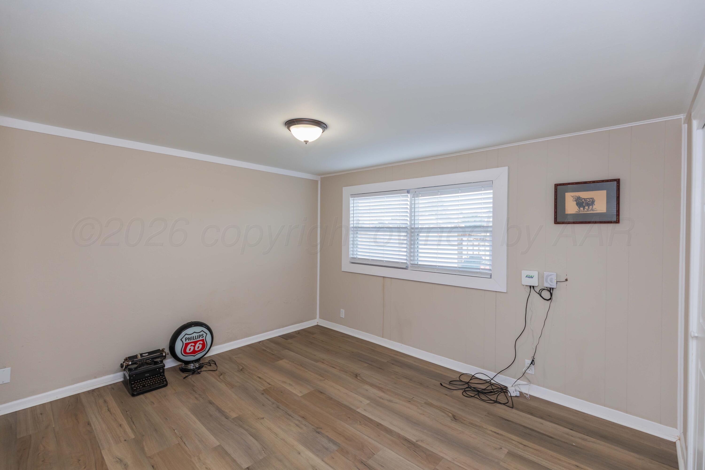 105 Smith Street Borger, TX 79007 - Photo 20 of 26 a view of an empty room with a window