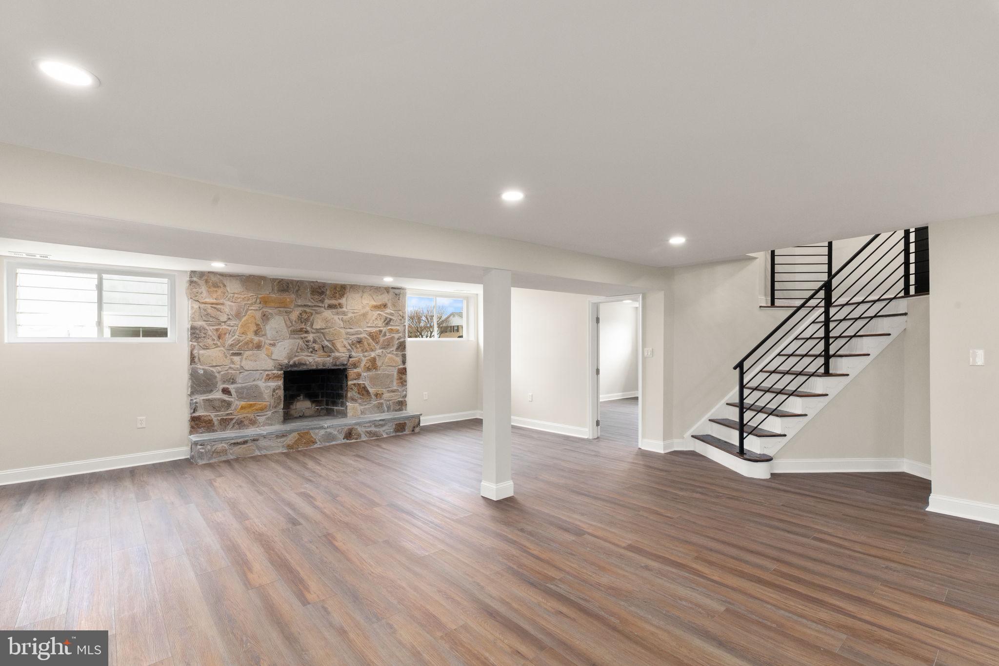 9708 Eustice Road Randallstown, MD 21133 - Photo 29 of 42 Lower Level Wood burning fireplace