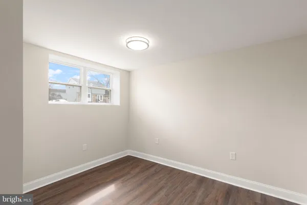 a bathroom with a sink a shower and a mirror