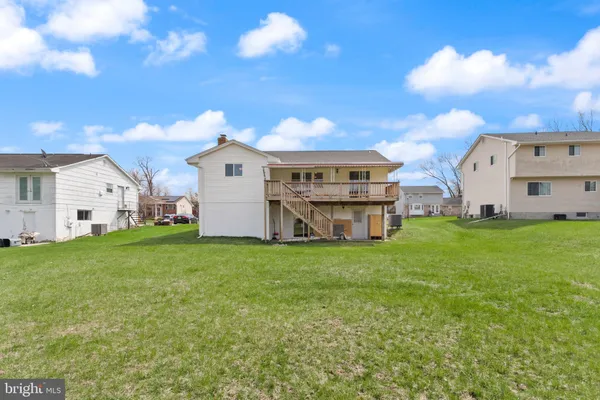 a view of a big yard with table and chairs