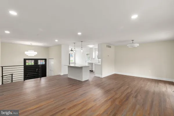 a view of kitchen with refrigerator and window
