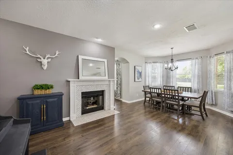 a kitchen with a dining table a sink and cabinets