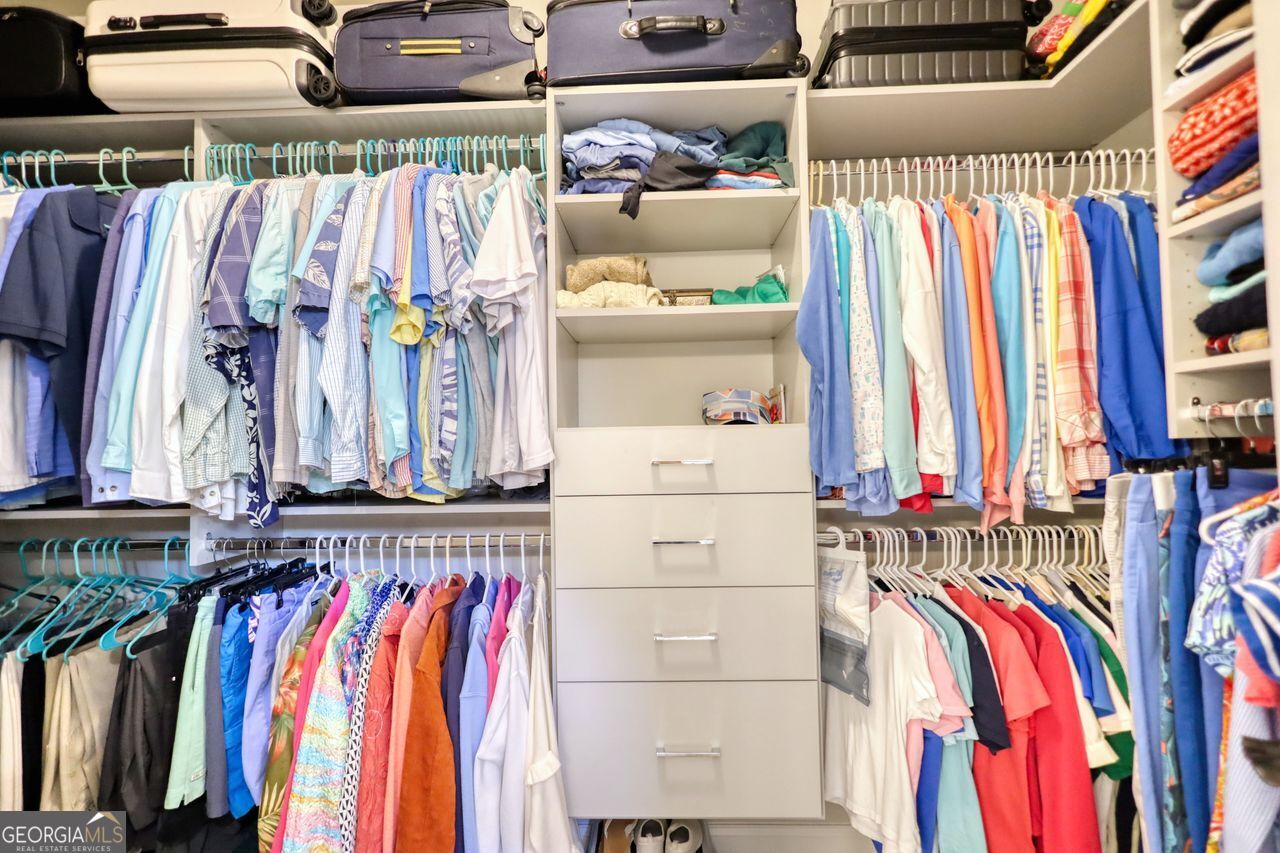 246 Club Drive Monroe, GA 30655 - Photo 14 of 18 a view of walk in closet with clothes and shoes