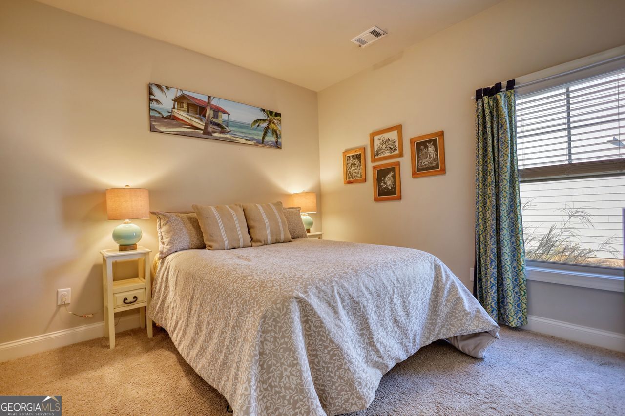 246 Club Drive Monroe, GA 30655 - Photo 16 of 18 a bedroom with a bed and a window