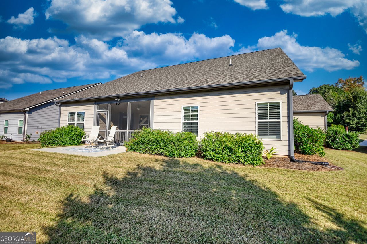 246 Club Drive Monroe, GA 30655 - Photo 17 of 18 a front view of house with yard and trees around