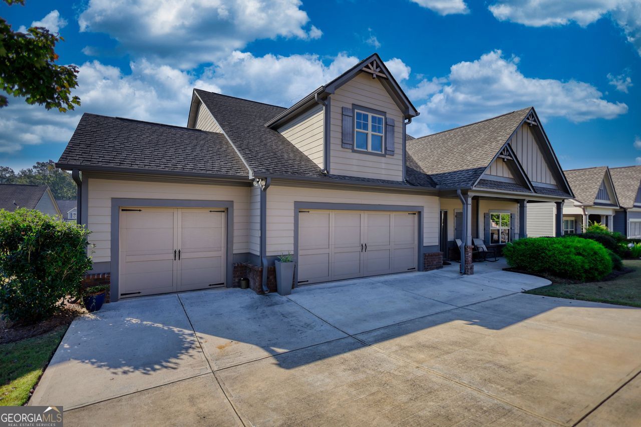246 Club Drive Monroe, GA 30655 - Photo 2 of 18 a front view of a house with a yard and garage
