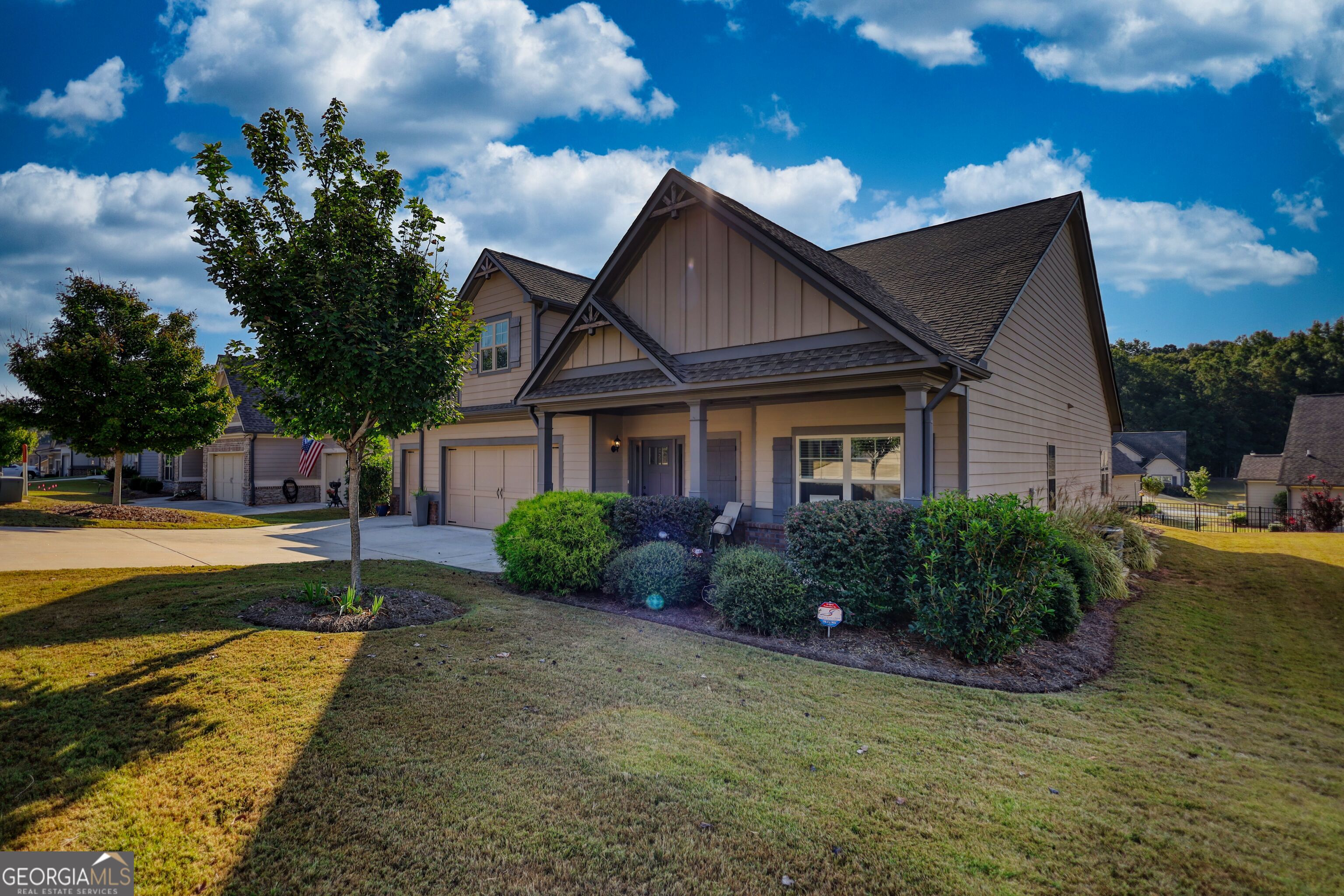 246 Club Drive Monroe, GA 30655 - Photo 3 of 18 a front view of a house with garden