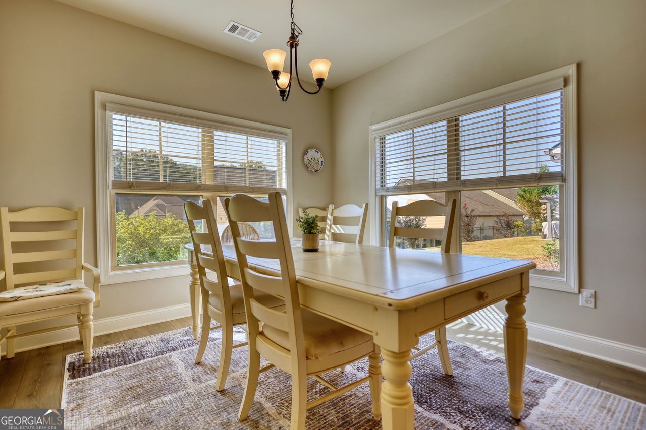 246 Club Drive Monroe, GA 30655 - Photo 6 of 18 a view of a dining room with furniture window and outside view