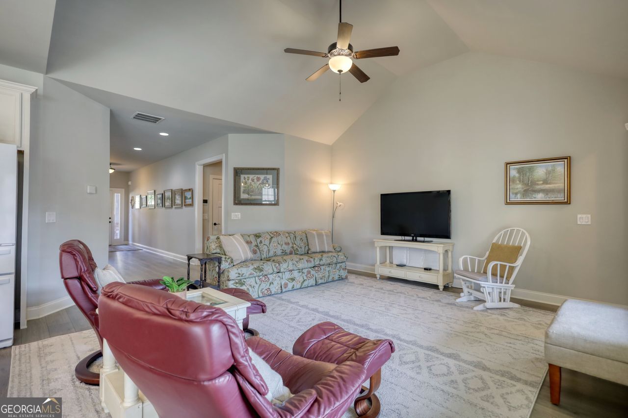 246 Club Drive Monroe, GA 30655 - Photo 10 of 18 a living room with furniture and a flat screen tv
