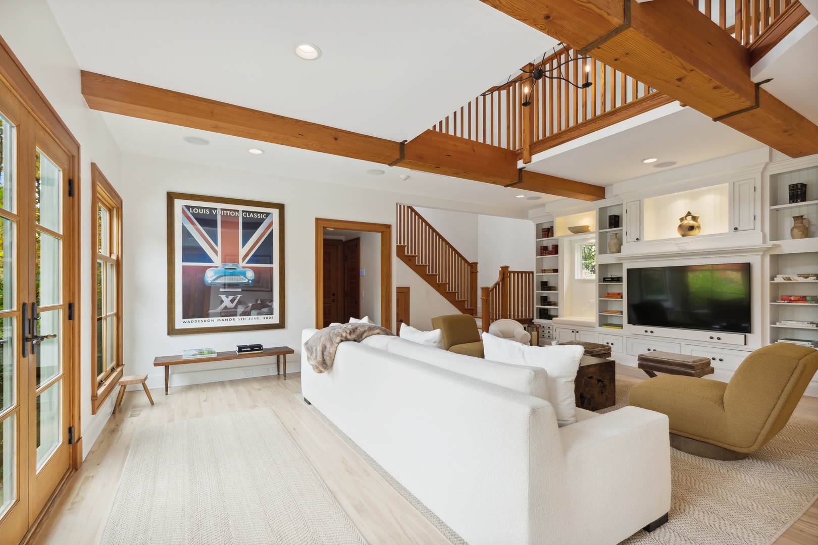 606 Tiverton Road Lake Forest, IL 60045 - Photo 23 of 48 a living room with furniture and a flat screen tv