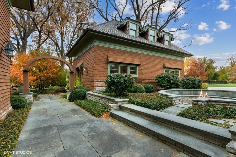 606 Tiverton Road Lake Forest, IL 60045 - Photo 34 of 48 a front view of a house with a garden