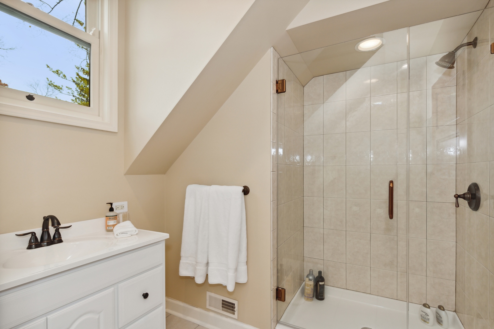 606 Tiverton Road Lake Forest, IL 60045 - Photo 38 of 48 a bathroom with a granite countertop sink a shower and a mirror