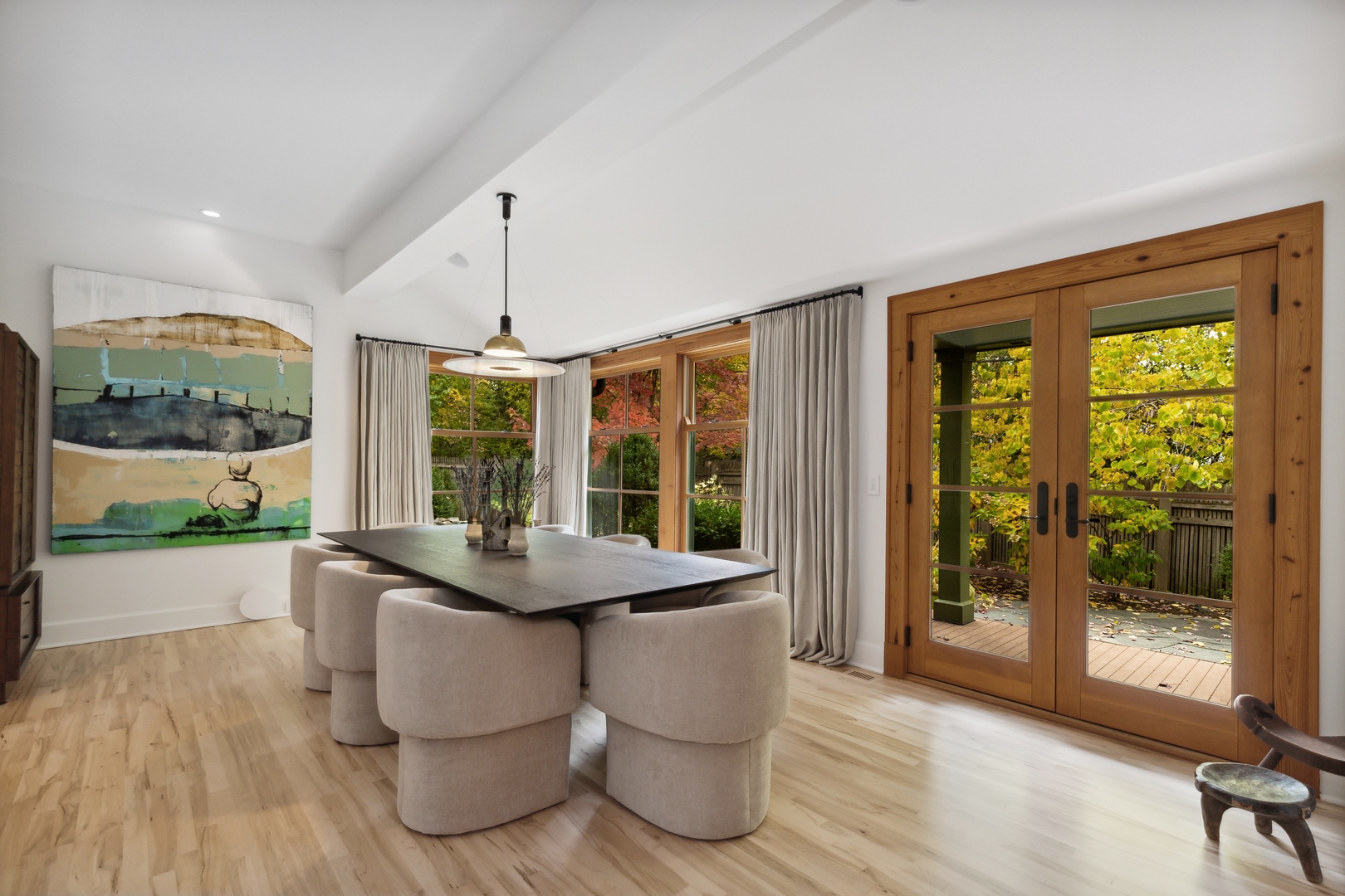 606 Tiverton Road Lake Forest, IL 60045 - Photo 10 of 48 a dining room with wooden floor a chandelier glass table and chairs