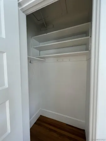 a view of small space with racks on the wall